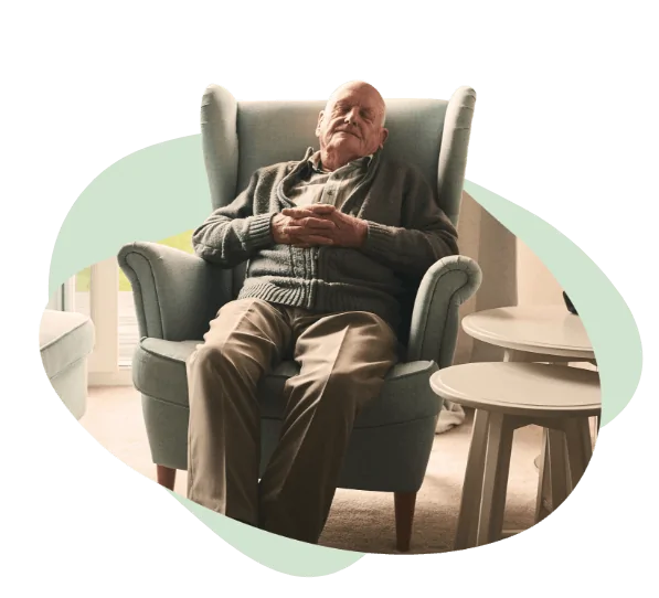 elderly man asleep in his chair