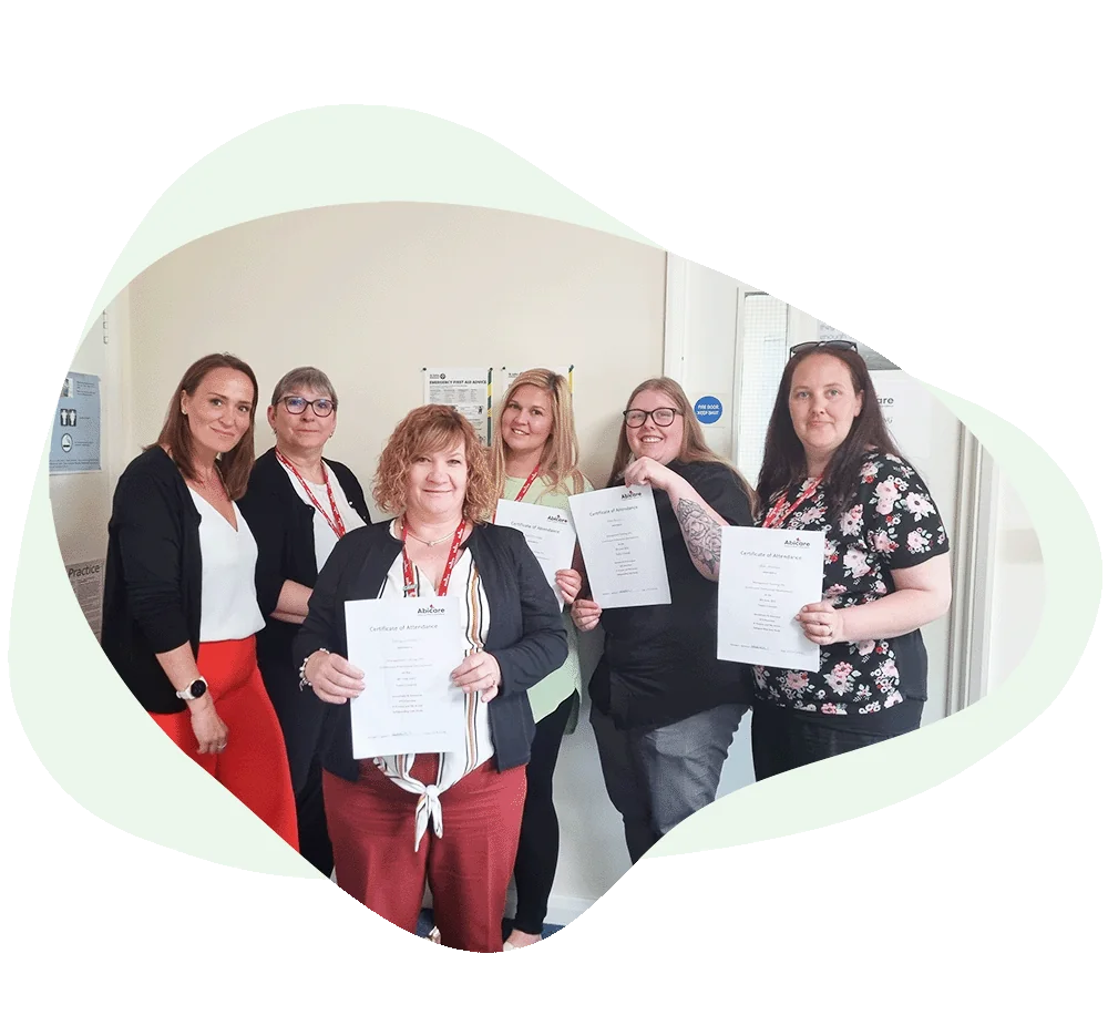 managers holding training certificate
